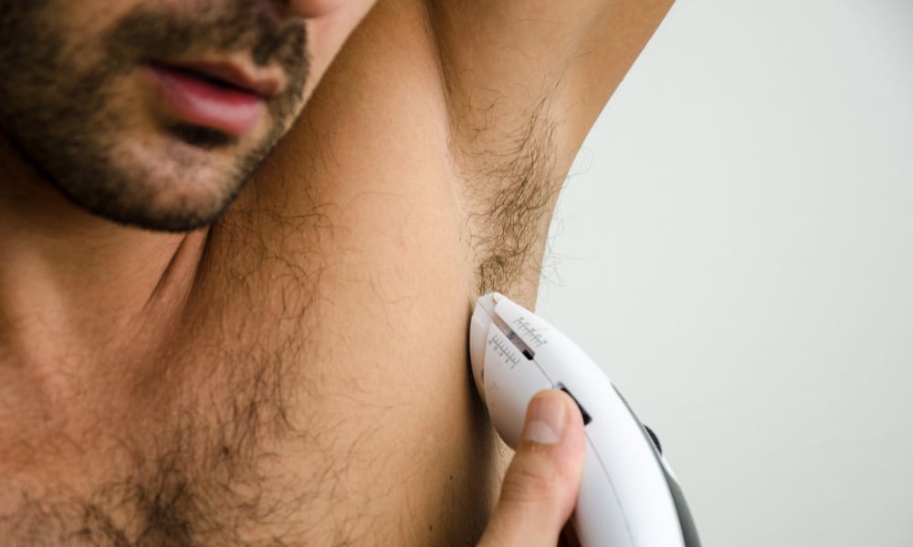 Man shaving his armpit