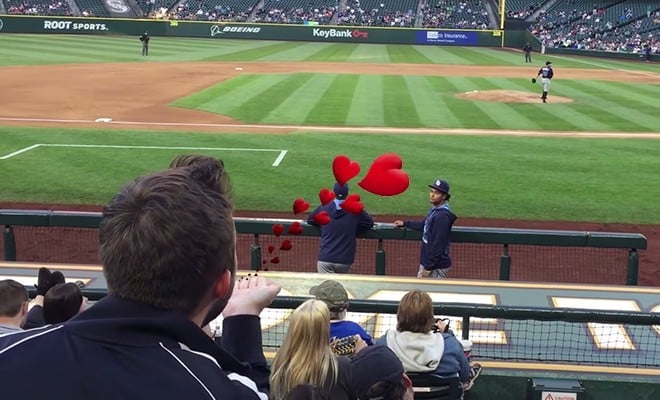 A photo of a gay fan blowing a kiss to player.