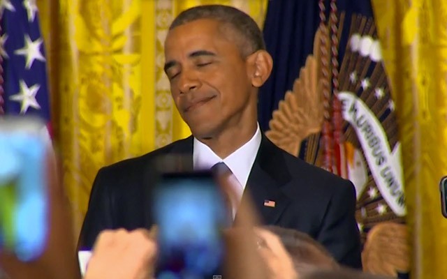 A trans woman interrupts Obama and he reacts by throwing her out of the White House.