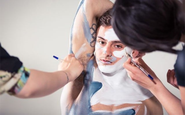 A photo of Tom Daley with body paint to make him look like a shark.