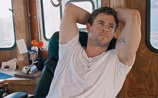 This is a photo of Chris Hemsworth from the short film ‘The Man Who Dreams Only of Surfing.’