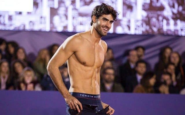 Model Juan Betancourt Strips for Rafael Nadal on Tennis Court