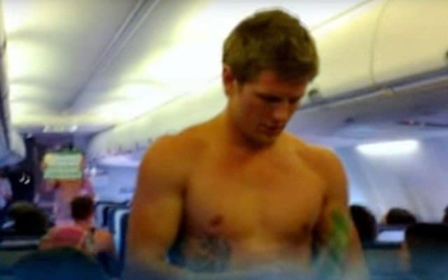 Shirtless Rugby Stud Explains In-Flight Safety