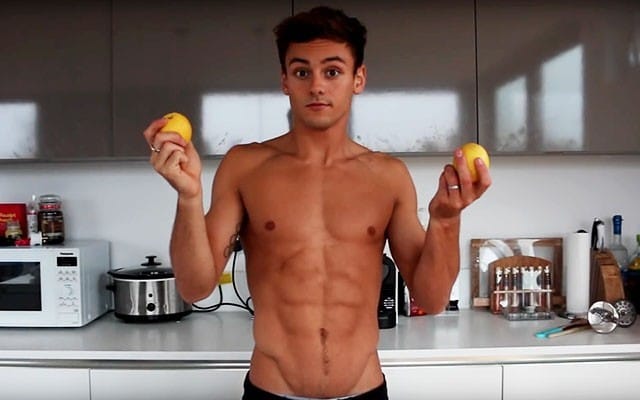 This is a photo of Tom Daley preparing a glass of lemon water.