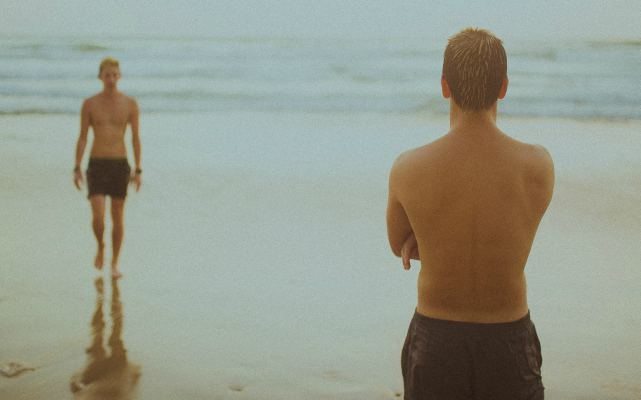 This is a photo of a young couple on the beach.