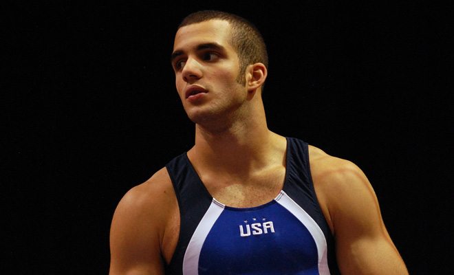 Danell Leyva performs a shirtless bar routine at the Rio Olympics.