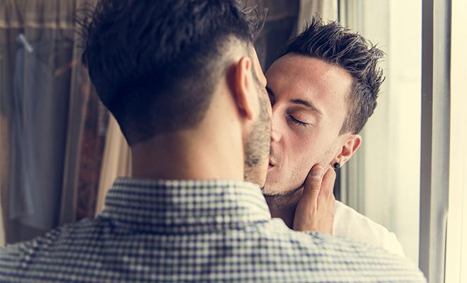 A gay Mormon couple kissing