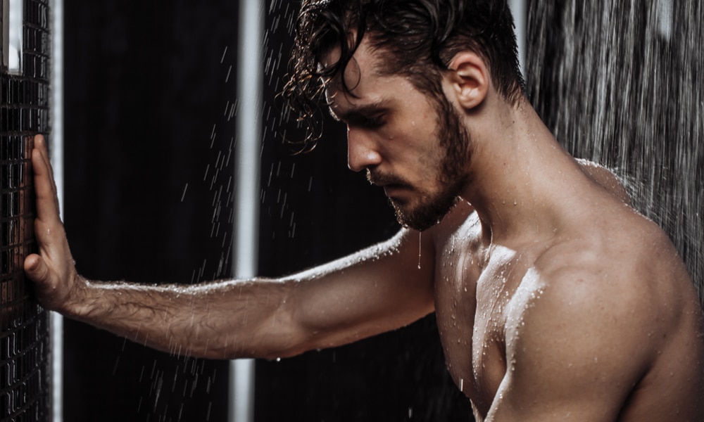 Guy showering at the gym