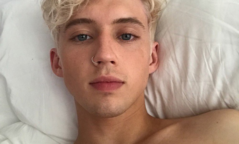 Troye Sivan in bed shirtless