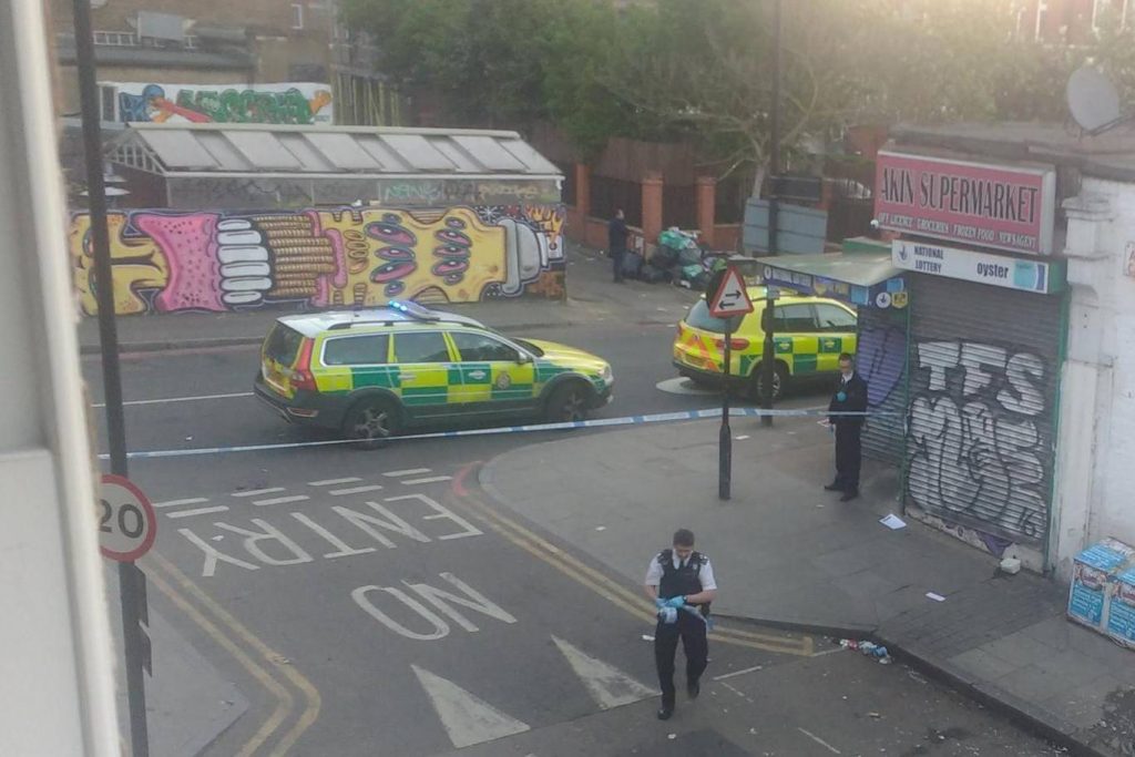 Police on the scene of the attack in Dalston