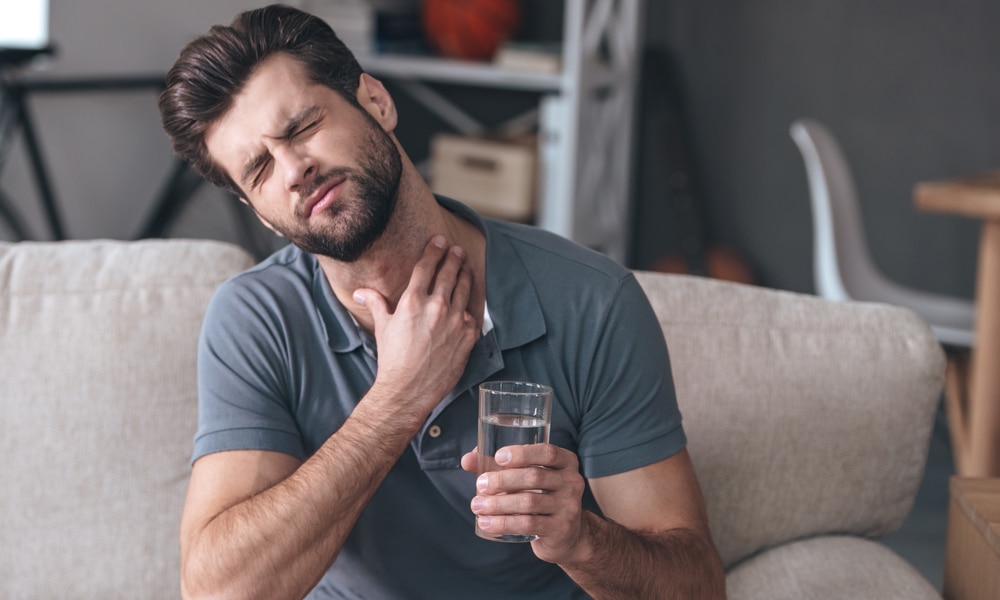 Young man with a sore throat