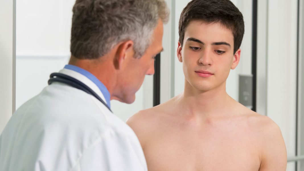 Young man with doctor