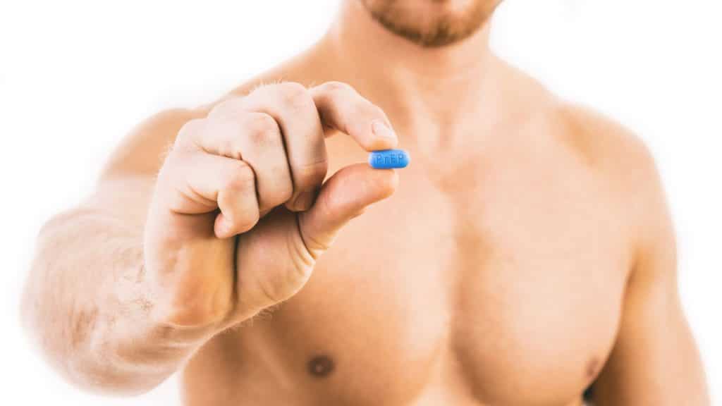 Man holding a HIV prevention pill. PrEP