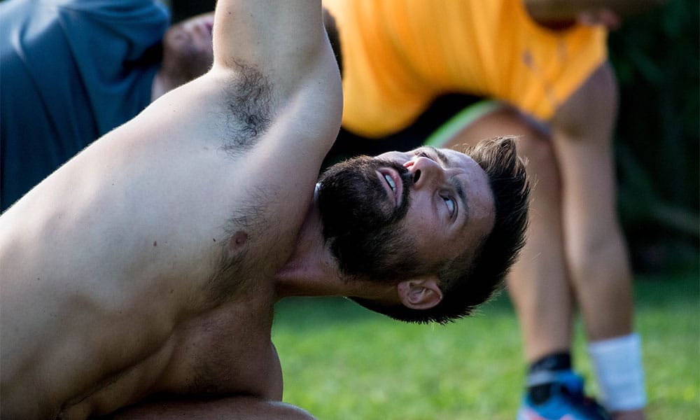 Man stretching on the lawn