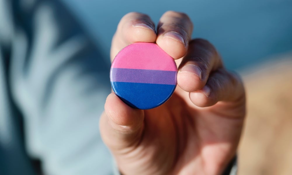 This is a photo of a bisexual flag pin