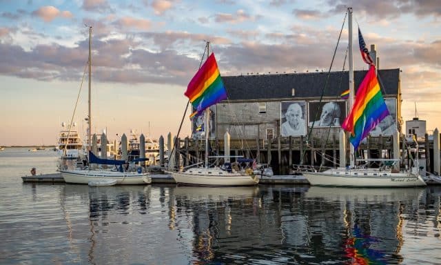 Boats and a decorated house in the Provincetown Marina.