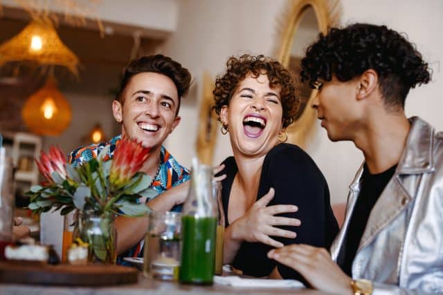 Queer friends enjoying meal