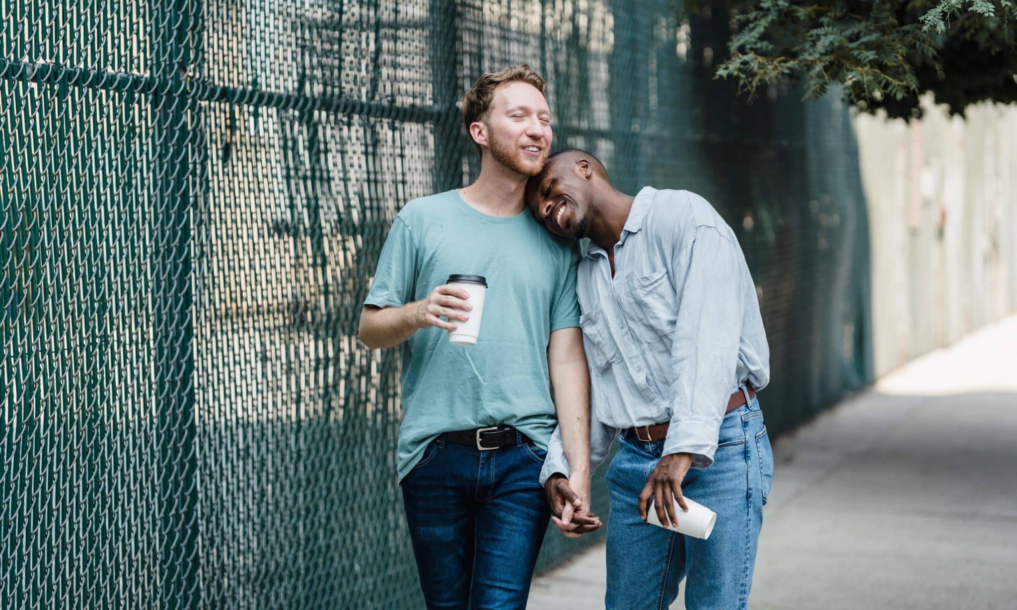 Happy Gay Couple on a Walk in City