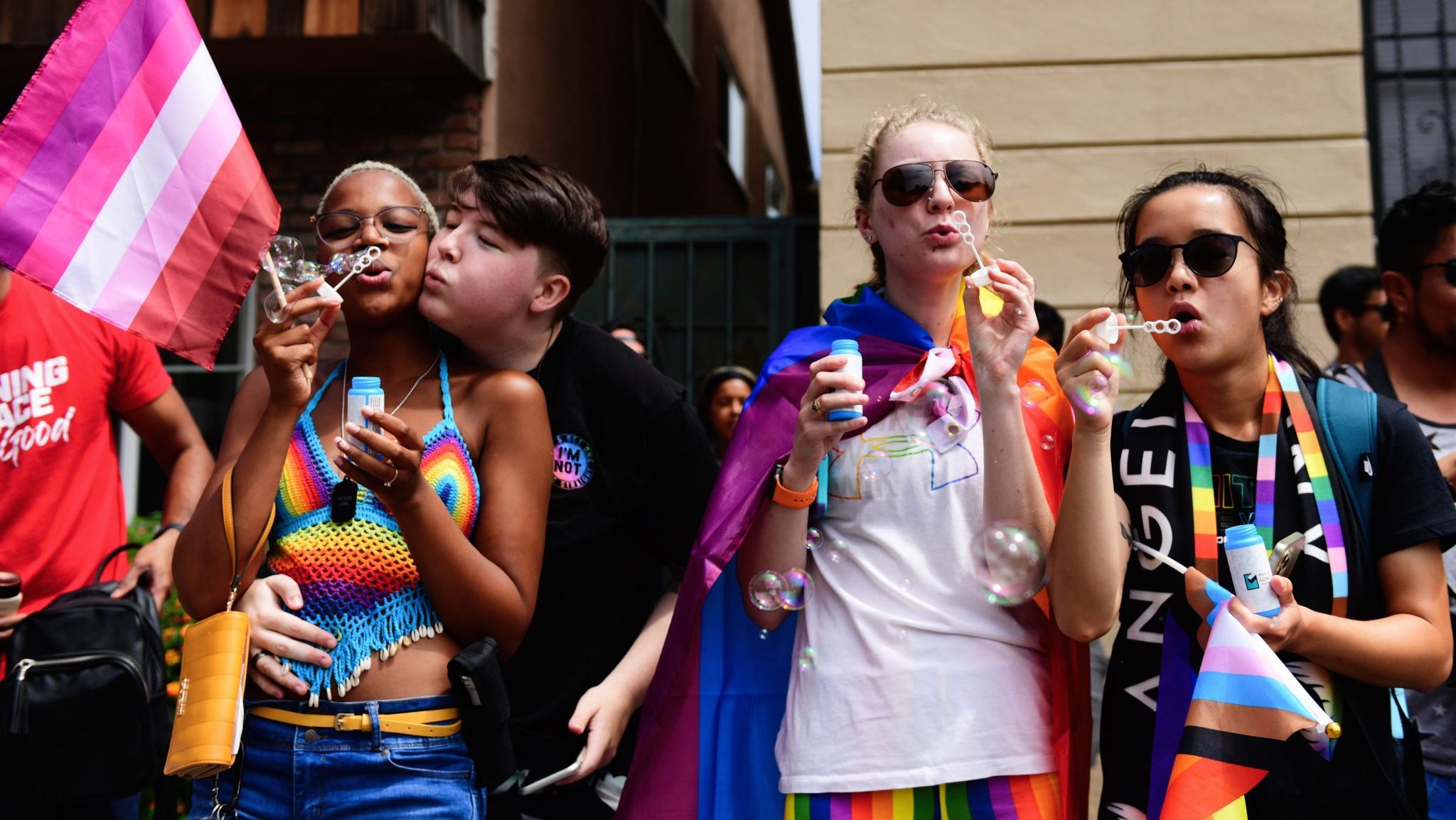 2022 Long Beach Pride Attendees blow bubbles during the 2022 Long Beach Pride Parade on July 10, 2022 in Long Beach, California