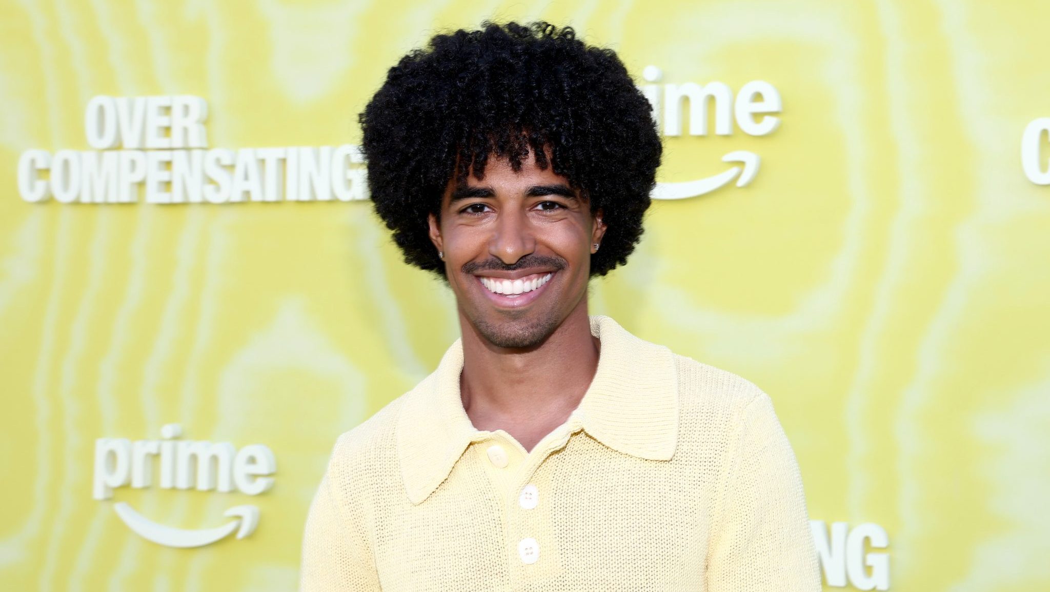 Boman Martinez-Reid reflects on college, gives advice, and celebrates his hit show 'Made for TV' at the 'Overcompensating' red carpet premiere in L.A.