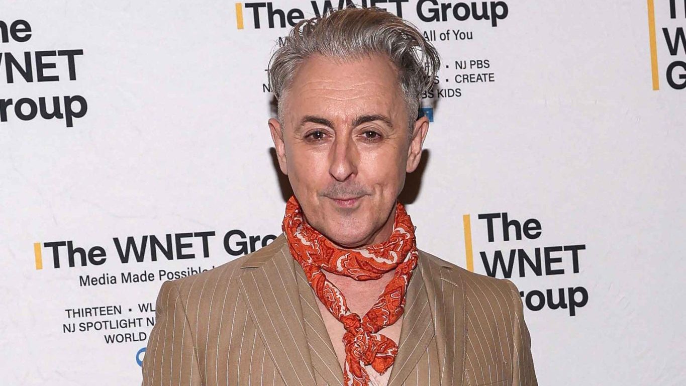 Alan Cumming gets candid on queerness, aging, fashion, and why visibility matters in ‘Them’ cover story.