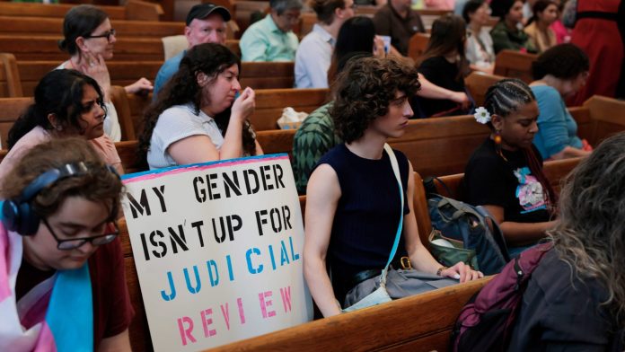 Activists attend a rally for transgender youth at the Lutheran Church of Reformation on June 18, 2025 in Washington, DC. Advocates organized the event in response to the U.S. Supreme Court’s ruling in U.S. v Skrmetti which upheld state bans on gender-affirming medical care for transgender youth. Activists attend a rally for transgender youth at the Lutheran Church of Reformation on June 18, 2025 in Washington, DC. Advocates organized the event in response to the U.S. Supreme Court’s ruling in U.S. v Skrmetti which upheld state bans on gender-affirming medical care for transgender youth.