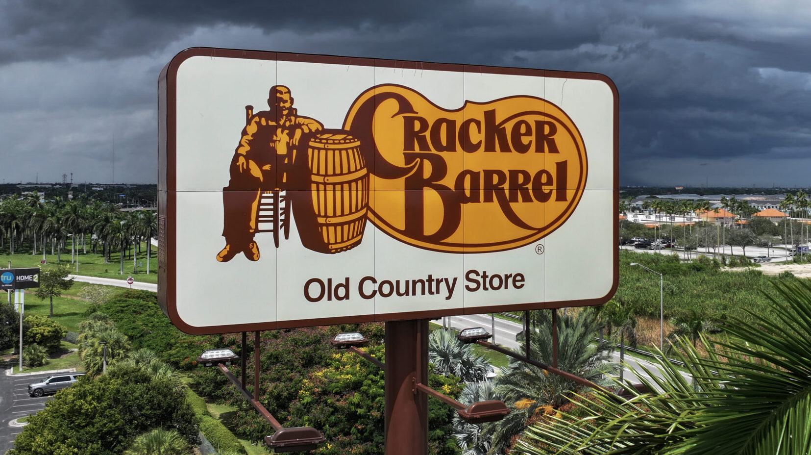 In an aerial view, a Cracker Barrel sign featuring the old logo hangs on a sign outside of a restaurant on August 27, 2025 in Florida City, Florida. The restaurant unveiled a new logo earlier this week as part of a larger brand refresh, but due to pushback from customers who didn't like the new logo, they announced that they will be keeping the old logo.