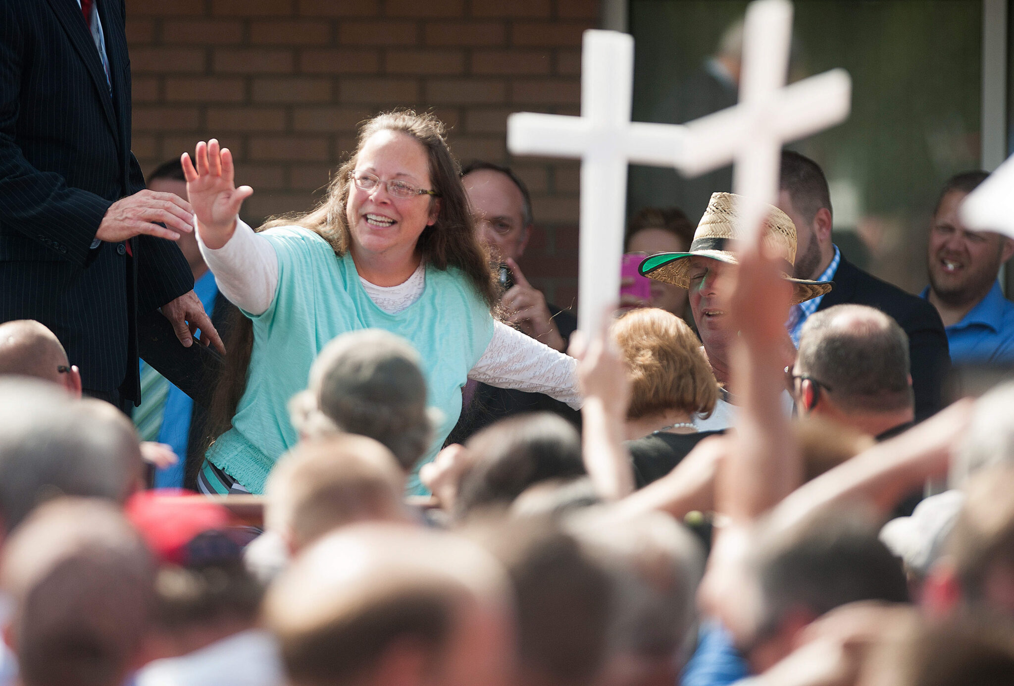 Rowan County Clerk of Courts Kim Davis waves to a crowd of her supporters at a rally in front of the Carter County Detention Center on September 8, 2015 in Grayson, Kentucky. Davis was ordered to jail last week for contempt of court after refusing a court order to issue marriage licenses to same-sex couples.
