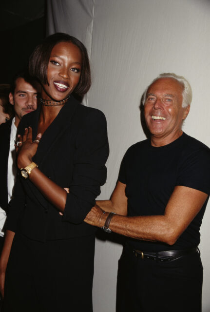 Italian fashion designer Giorgio Armani and English model Naomi Campbell attend a private party, 1996.