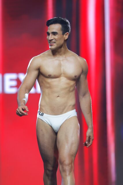 The men of Mister Global 2025 walk the stage for the swimsuit category in Thailand.