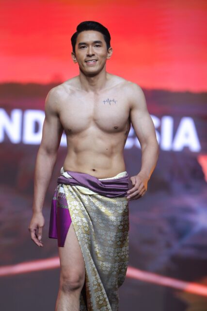 The men of Mister Global 2025 walk the stage in traditional Thai attire.