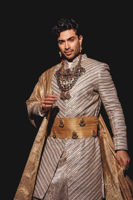 The men of Mister Global 2025 dressed in costume celebrating their unique cultural heritage.