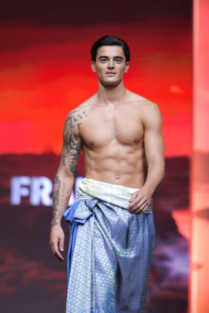 The men of Mister Global 2025 walk the stage in traditional Thai attire.