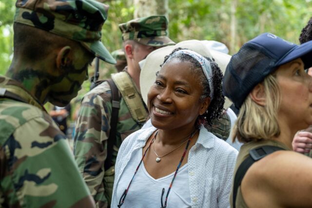 BOOTS. (L to R) Rico Paris as Santos and Director Tanya Hamilton (107) behind the scenes of Episode 107 of Boots. Cr. Patti Perret/Netflix © 2024