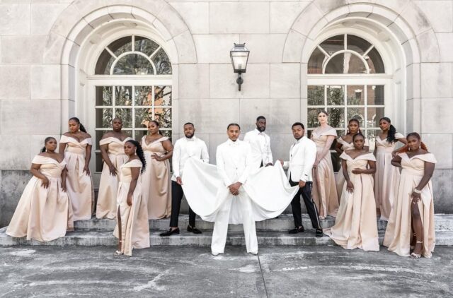 Jordan Taylor Capers (center) surrounded by members of their wedding party outside Macon Terminal Station in Macon, GA. (Photo by LaJoy Photography)