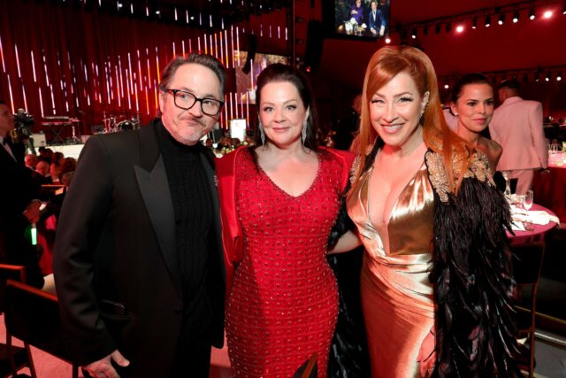 (L-R) Ben Falcone, Melissa McCarthy and Lisa Ann Walter attend Elton John AIDS Foundation's 34th Annual Academy Awards Viewing Party on March 15, 2026 in West Hollywood, California.
