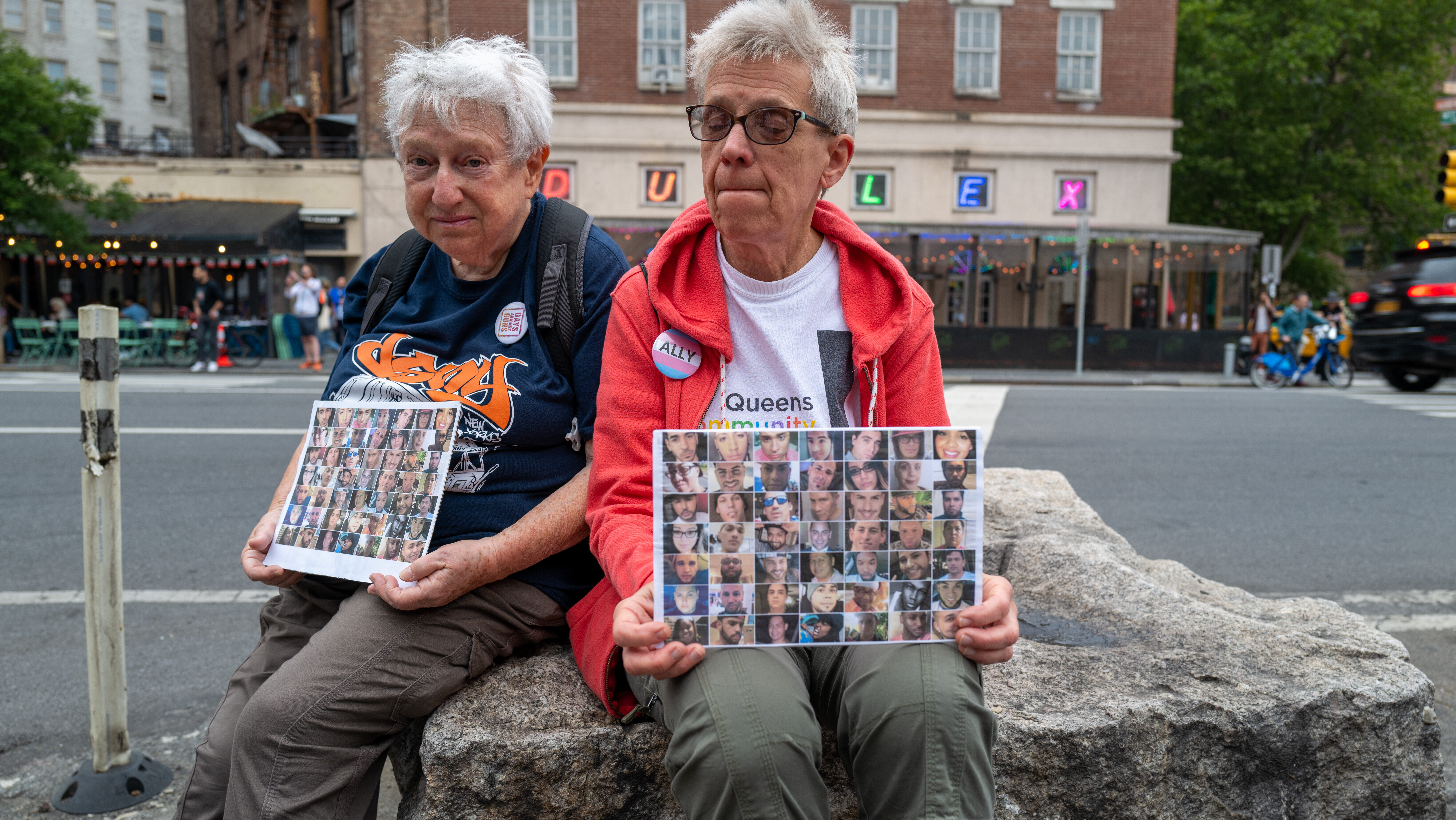 Members of the activist group Gays Against Guns hold pictures of the deceased during a silent vigil to mark seven years since the Pulse Nightclub mass shooting, one of the worst mass shootings in American history, on June 12, 2023 in New York City. The vigil began at the Stonewall Inn, a gay bar and National Historic Landmark in Manhattan's West Village. On June 12, 2016, Omar Mateen, a 29-year-old man, killed 49 people and wounded 53 more in a mass shooting at Pulse, a gay nightclub in Orlando, Florida.