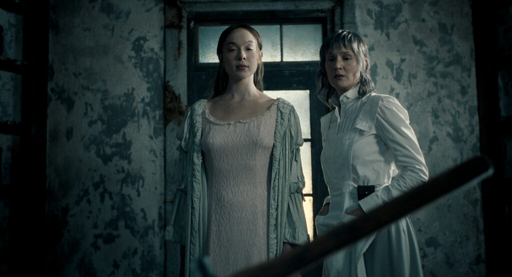 Monster: The Lizzie Borden Story. (L to R) Ella Beatty as Lizzie Borden, Vicky Krieps as Maggie Sullivan in episode 402 of Monster: The Lizzie Borden Story. Cr. Courtesy of Netflix © 2026