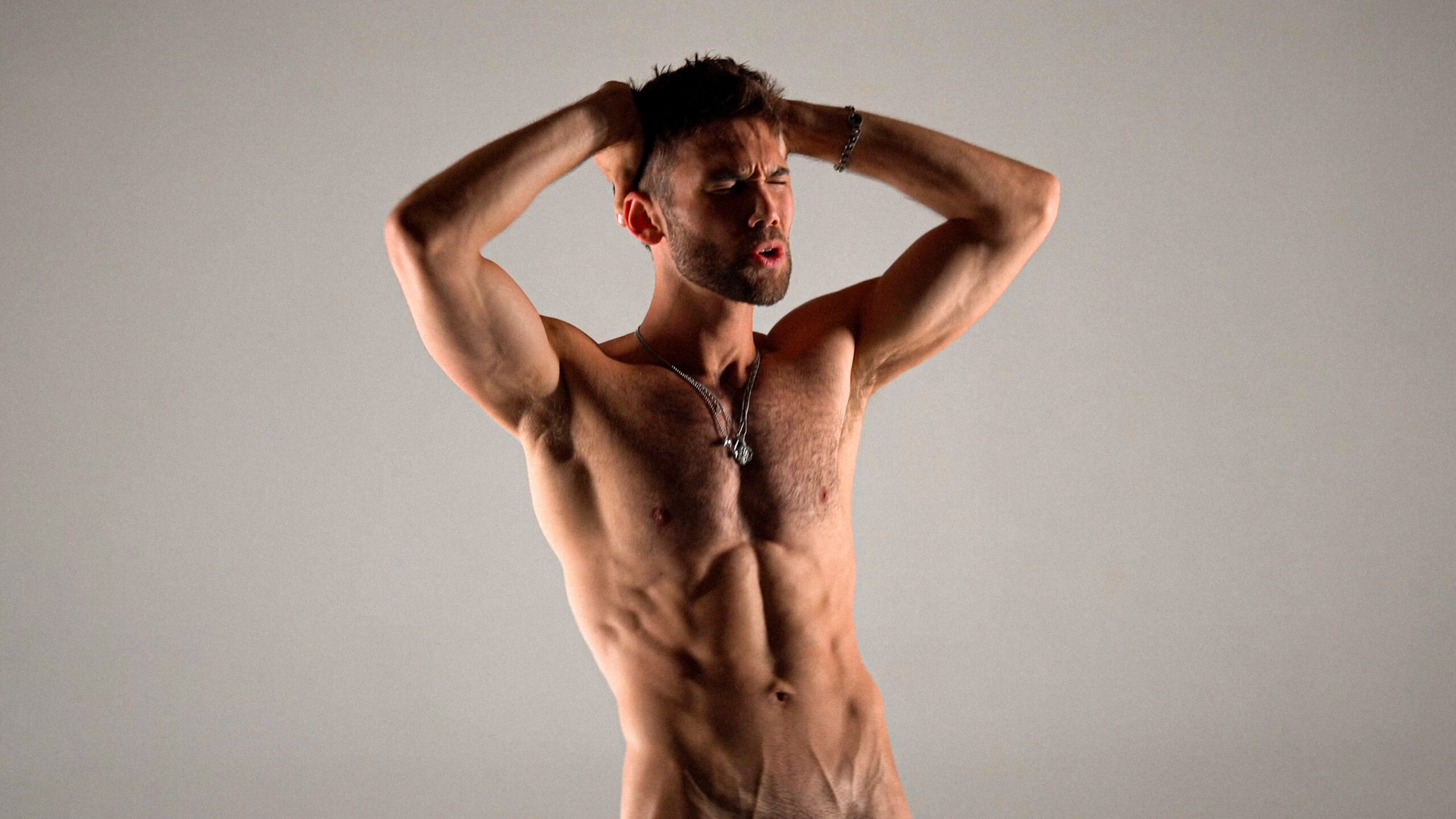 Pop star Grant Knoche bare it all in his new "STRIPPED" music video, opening up about body image, desire, and his album Good Luck Getting Over Me.