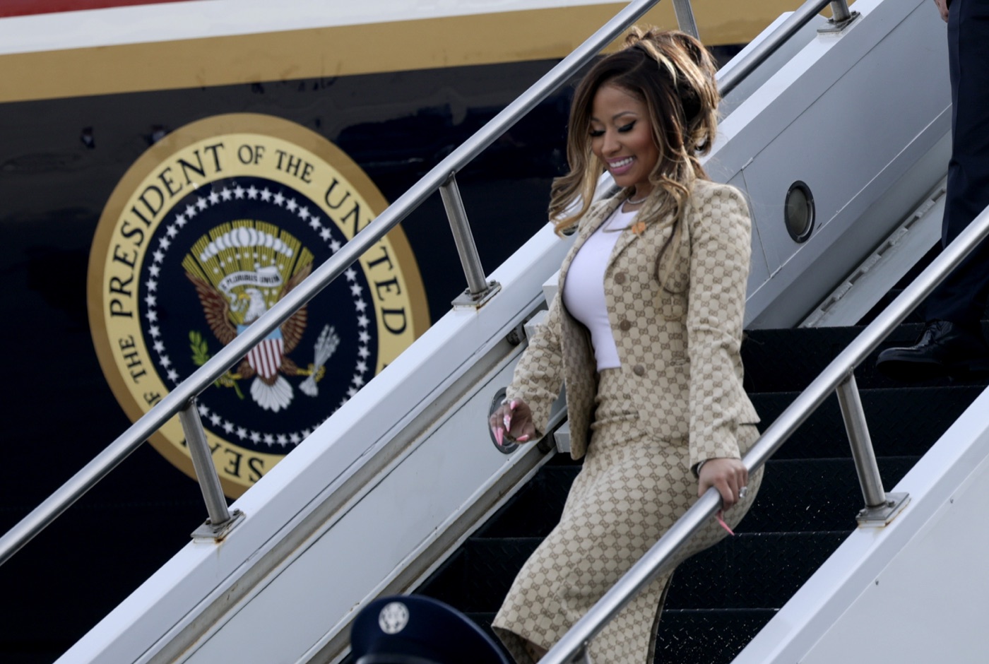 Nicki Minaj descends the Air Force One stairs at Selfridge Air National Guard Base in Michigan.